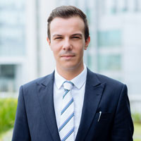 Professional businessman portrait representing corporate consulting, finance, and business services.
